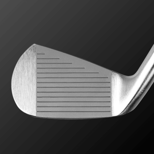 Caiman IV MB golf club head showing precision grooves and design, crafted from S20C soft iron for enhanced performance.