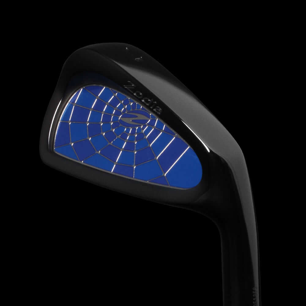 Cavity Badge DLC Black golf club head featuring a blue spider design and sleek black finish against a dark background.