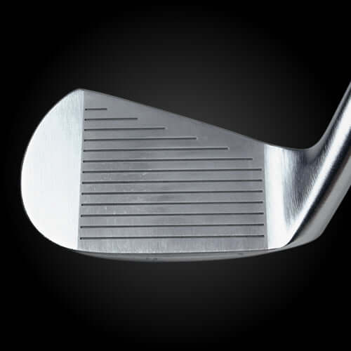 Close-up view of the Crocodile Muscle golf club face showing grooves and sleek design.
