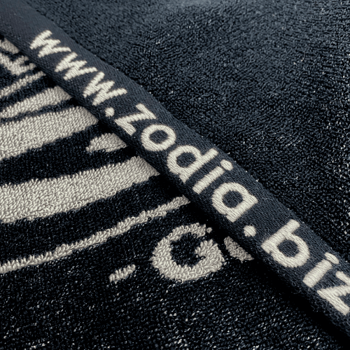 Crown Logo Towel featuring high-quality jacquard weaving in black color with website branding.