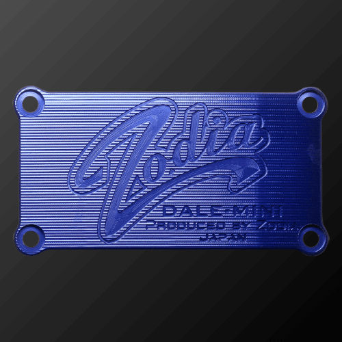 DALE MINI PUTTER CRANK blue plate with Zodia logo, featuring distinct texture and design elements.