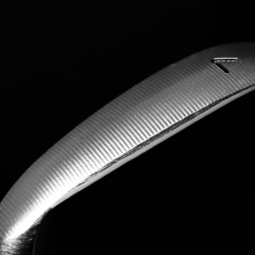 Close-up of the polished edge of the DIAMOND BR III iron, showcasing its precision CNC milling design.