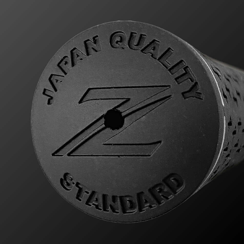 Close-up of Silky Rubber Grip with Japan Quality marking, showcasing its black textured surface.