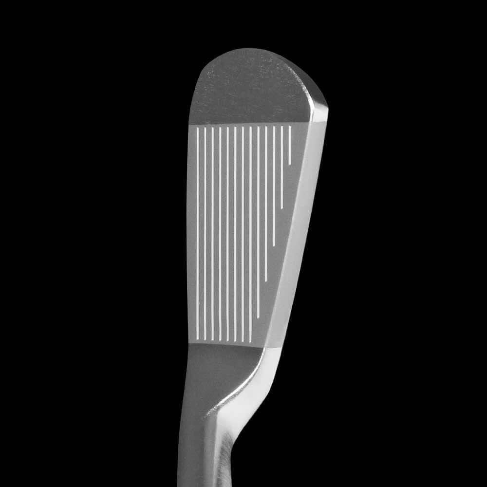 Close-up view of the Spider CB iron club face, showcasing the premium design and precision grooves.