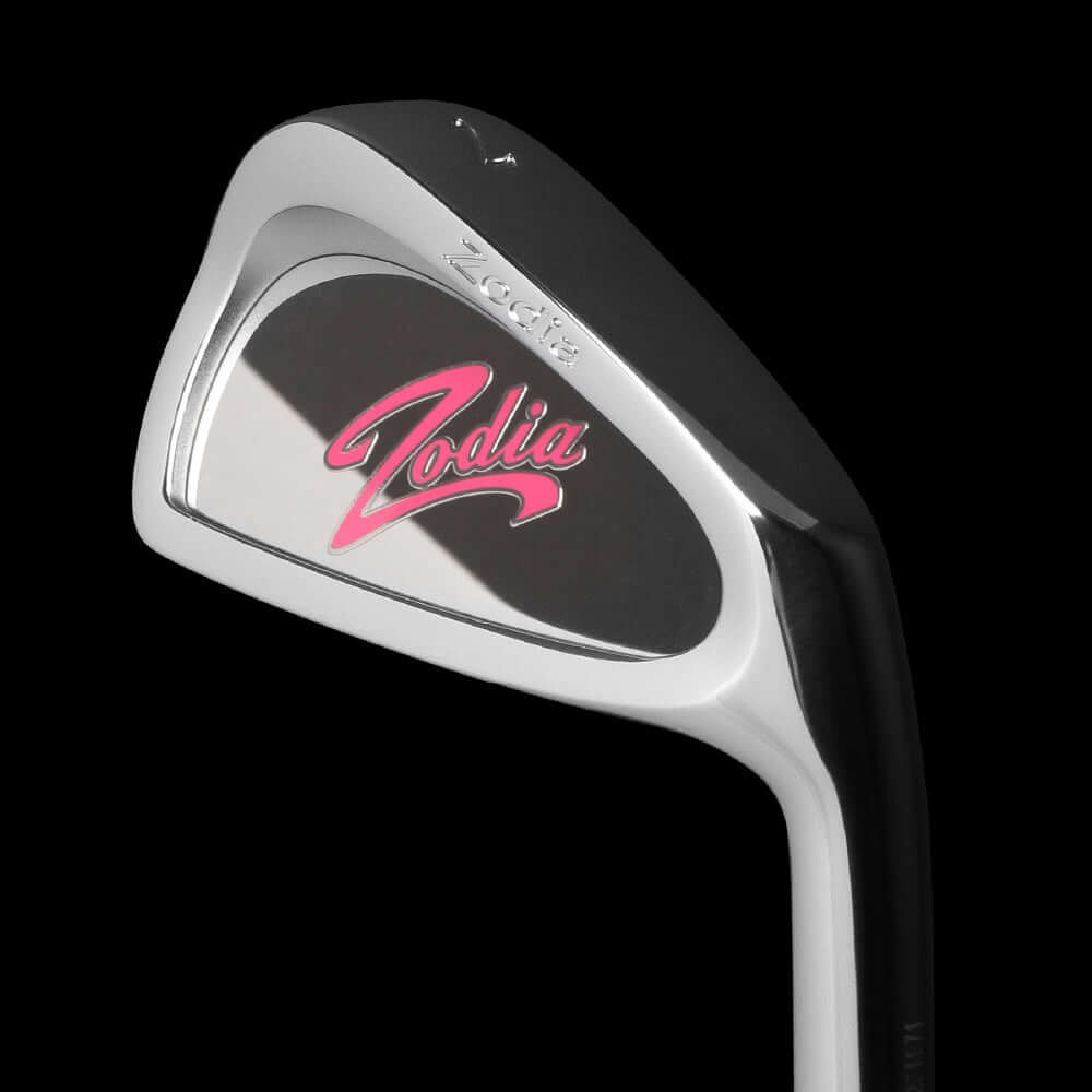 Cavity Badge Chrome golf club with pink Zodia logo, featuring a lightweight design and forgiving sharp face shape.