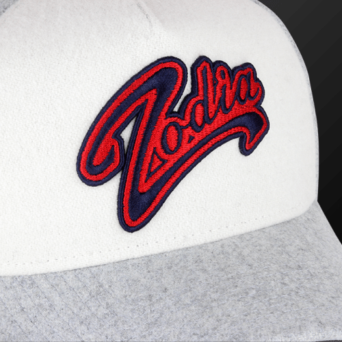 Zodia × NEW ERA Wool Cap featuring embroidered logo on a stylish gray and white design.