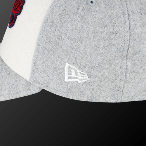 Zodia × NEW ERA Wool Cap close-up showing gray wool texture and embroidered logo details.
