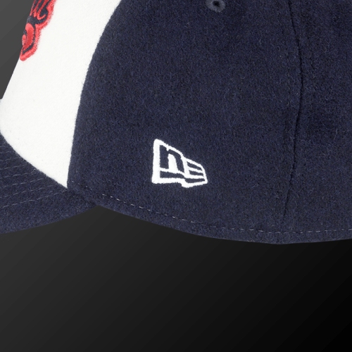Zodia × NEW ERA Wool Cap featuring a close-up view of the navy wool material and logo detail.